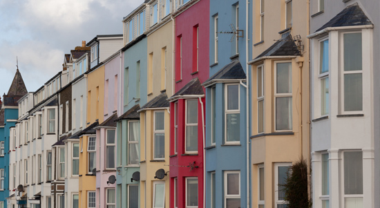 A row of colourful homes in a street